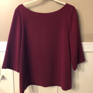 Women’s boat neck back zip top